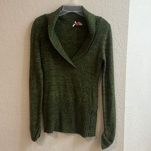 Green v-neck sweater with buttons at the waist